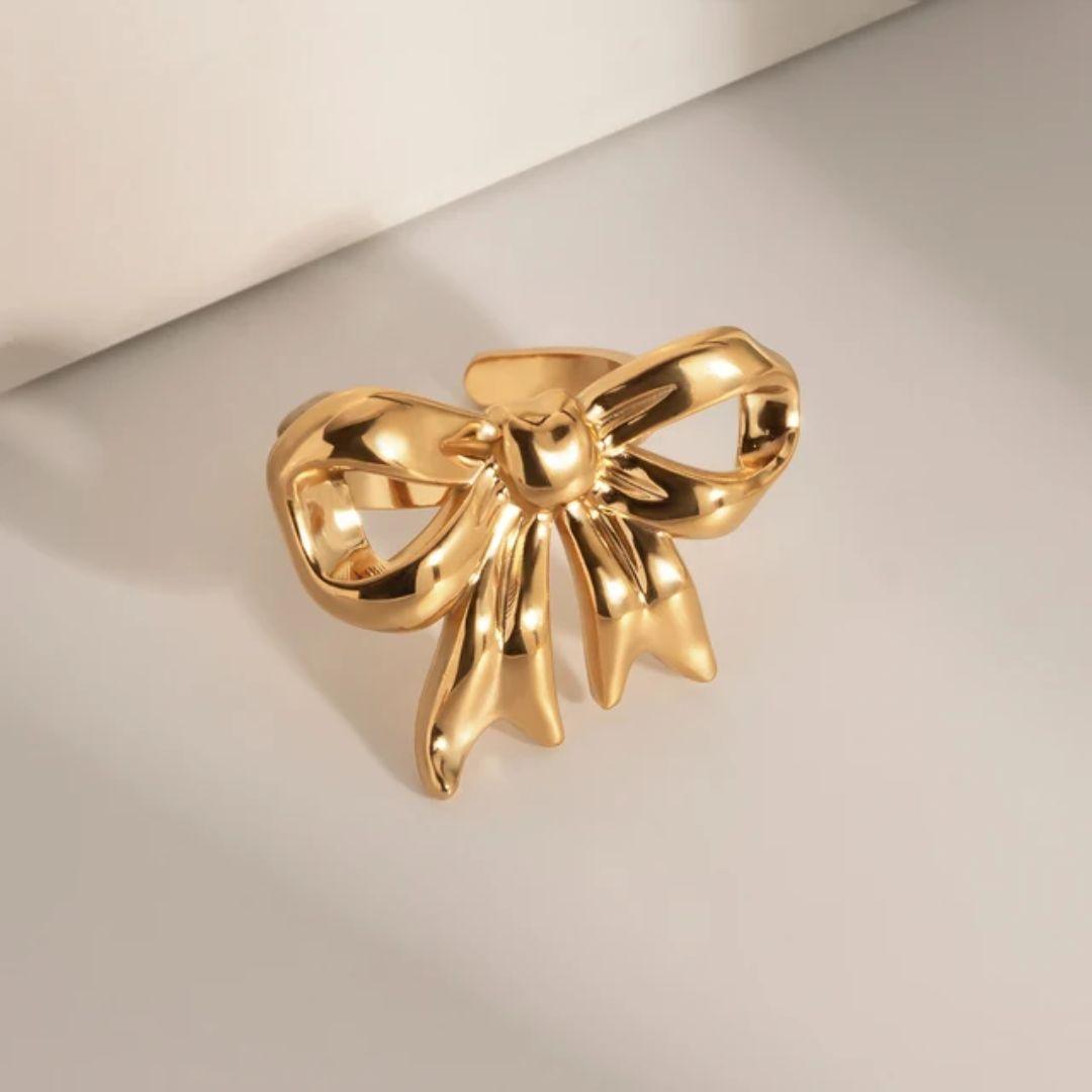 As pretty golden bow ring